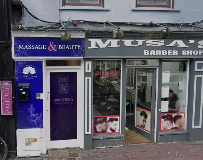 Street view of Musa’s Barbers on Grand Parade, Cork, looking in from the pavement